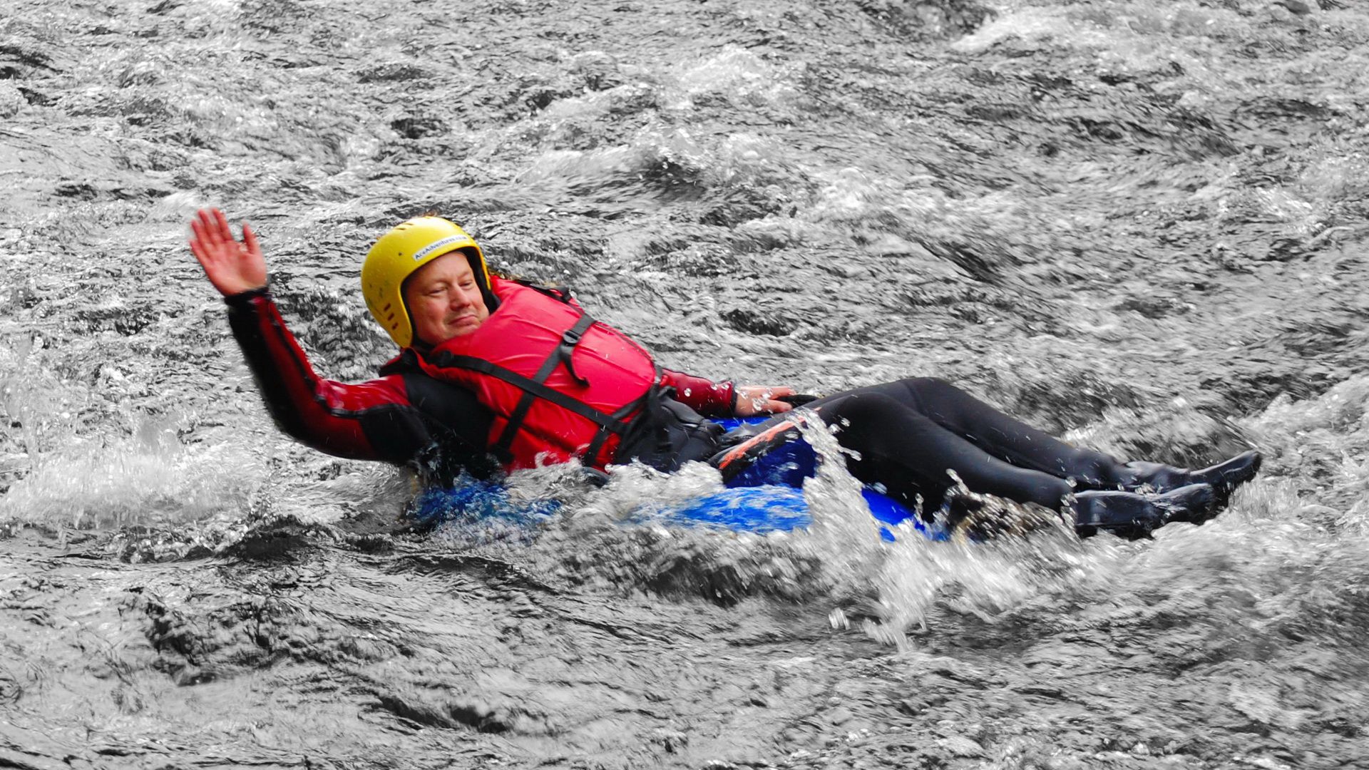 f8e2b4b395626719b39b43c80e33a601 a man on a tube in a river
