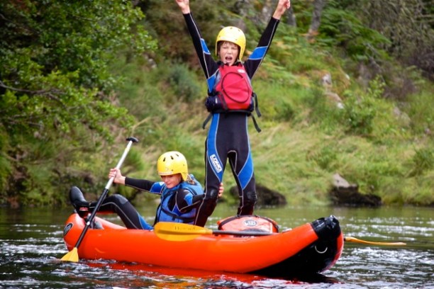 two kids kayaking in moray