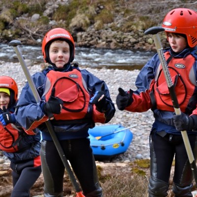 three boys with thumbs up