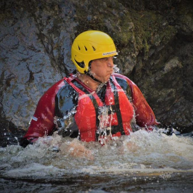 a man cliff jumping at ace adventures