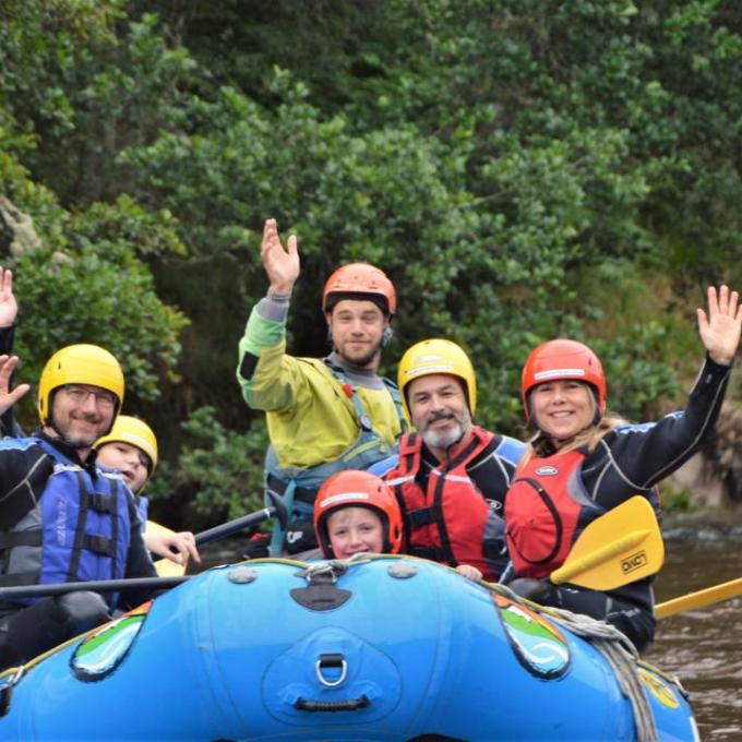 a family white water rafting at ace in scotland