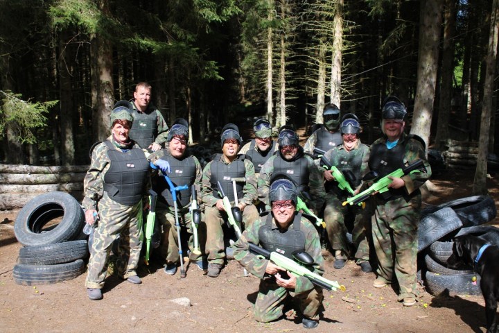 a group of people in uniform posing for a picture